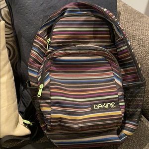 Girls/Teens Multi striped DAKINE backpack.